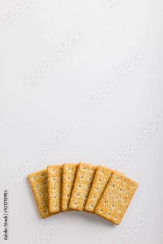 Overhead view of crackers on white background with copy space