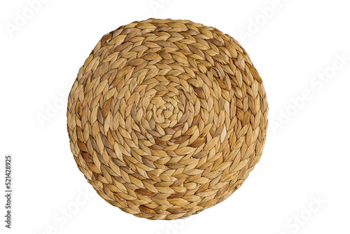 Kitchen decor round straw wicker stand, serving raffia place mat on isolated background. Tropical beach boho style