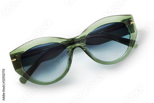 Sunglasses in green bright color in transparent plastic. Eyewear top view with shadow. Trendy glasses isolated on white background. Fashion spectacles for women with blue shade polarized lens.