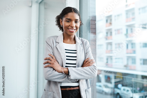 Confident manager, leader and creative boss with her arms crossed in a powerful, assertive and proud stance. Portrait of smiling, happy and female marketing agent ready for success with arms folded