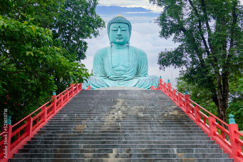 The Great Buddha (Daibutsu) on the grounds of Wat Phra That Doi Phra Chan Temple in lampang Thailand
