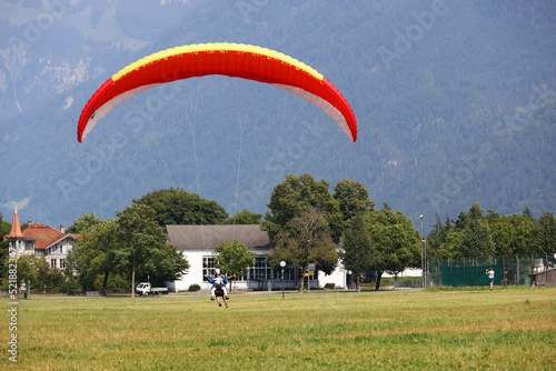 Paragliding in Interlaken, Switzerland, Europe. Interlaken is famous resort in paragliding flights