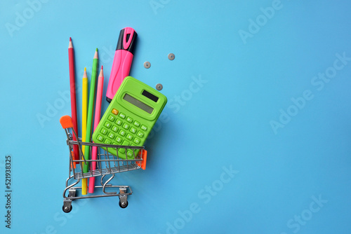 School supplies in the shopping cart. Buying school supplies