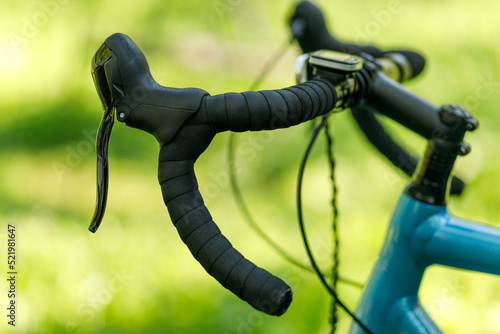 Gravel bike handlebar with winding, brake levers and shifter.