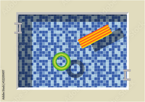 Vista aérea de una piscina con teselas azules como fondo y un flotador y colchoneta sobre el agua