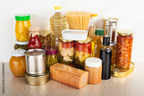 Emergency survival food set on white kitchen table