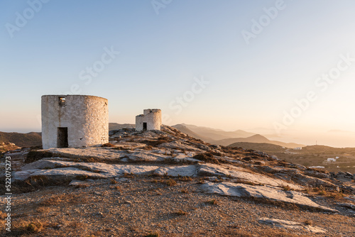 Golden hour view of the traditional windmills of Chora, on Amorgos island in Greece.