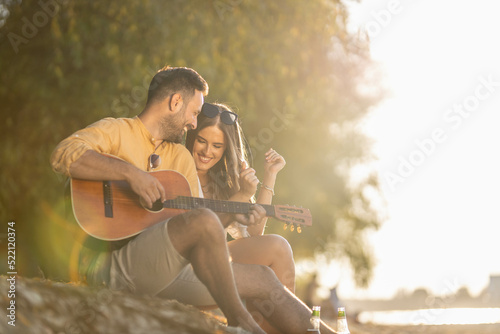 Couple cuddling and having a great time on beach side