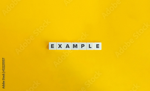 Example Word on Letter Tiles on Yellow Background. Minimal Aesthetics.