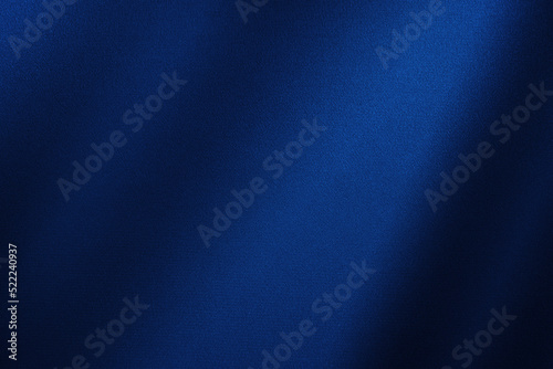 Abstract dark blue background. Silk satin. Navy blue color. Elegant background with space for design. Soft wavy folds.