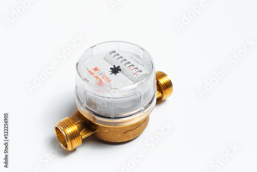 Close-up of water meter for hot water on white background.