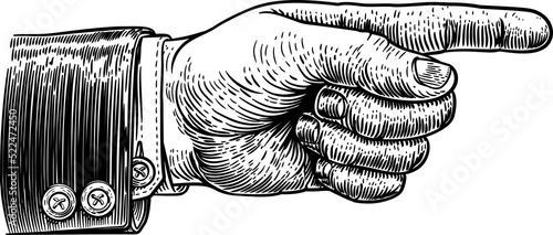 A hand pointing a finger in a direction sign. Wearing a business suit in a vintage antique engraving woodblock or woodcut style.