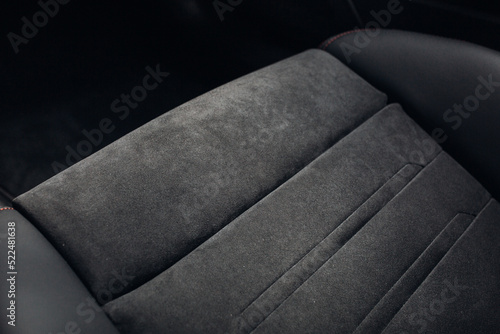 Grey alcantara texture. Close-up car seat fabric material. The surface of leatherette for textured background. 