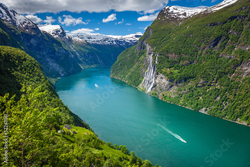 Ferry ship crossing Geirangerfjord and Seven Sisters Waterfalls, Norway