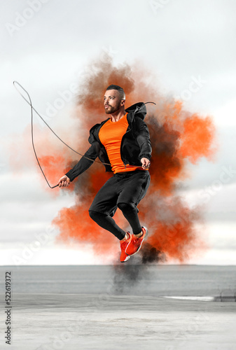 Picture for fitness studios and gym. Athlete man jumping before morning run outdoors