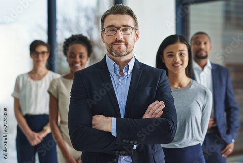 Team of smart and successful business people, leader or manager looking happy, satisfied or confident with their job, career and business. Face portrait of smart or ambitious corporate men and women