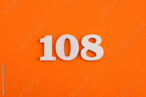 Number 108 - On orange foam rubber background