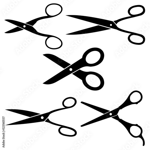 Different pairs of scissors on white background