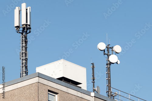 mobile phone antenna tower on a roof