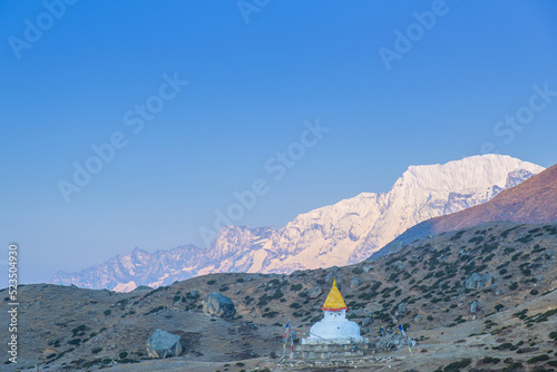 Stupa near Dingboche village with prayer flags and mounts Kangtega and Thamserku - way to mount Everest base camp - Khumbu valley - Nepal
