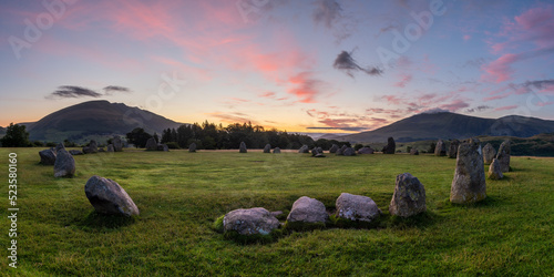 Pink and purple sunrise with a panoramic view of Castlerigg Stone Circle, Keswick, Lake District, UK. Popular sightseeing locations in Great Britain.