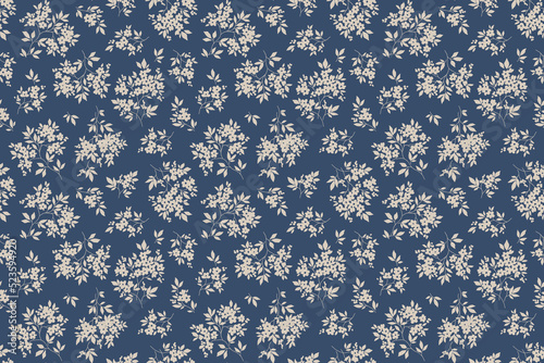 Vintage floral pattern in small abstract flowers. Small ivory white flowers. Blue background. Ditsy print. Floral seamless background. The elegant the template for fashion prints. Stock pattern.