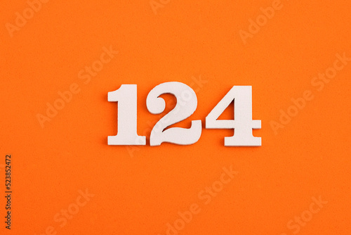 Number 124 - On orange foam rubber background