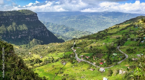 Aerial view of houses on a green hill in Choachi, Colombia