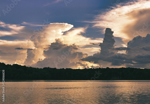 A landscape of a dramatic cloudy storm sunset over lake Benson in North Carolina