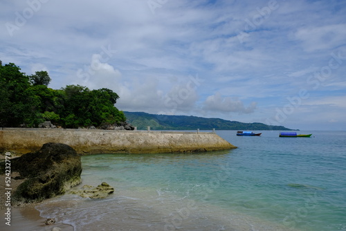 Indonesia Alor Island - Coastline landscape wit beach and fishing boats