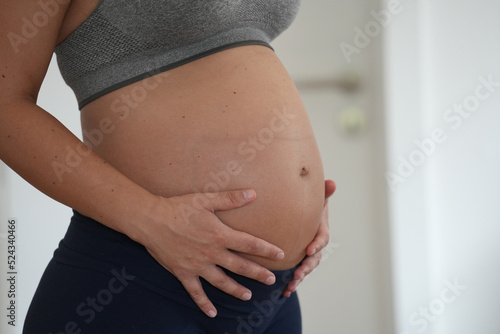 Pregnant expecting Mother showing baby belly.