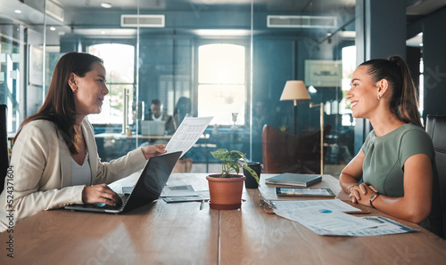 Job interview for a business woman at a hiring company talking to the HR manager about the role or position. Young female applicant or candidate in a meeting with an employer having a discussion