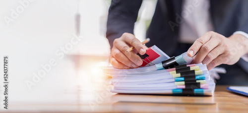 Business accountant document legal, Auditor businesswoman Office employee working with documents at the table workplace, closeup