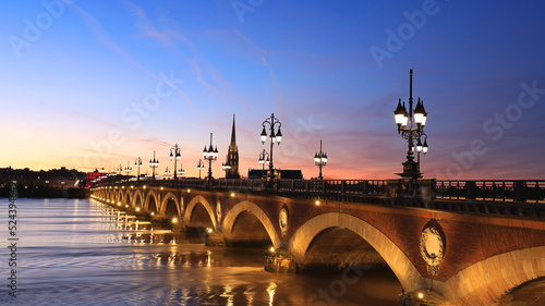 Beautiful View of the Pont de pierre with sunset sky scene which The Pont de pierre crossing Garonne river.
