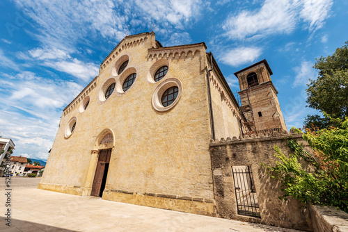 Main facade of the medieval Cathedral of Santa Maria Maggiore in Romanesque Gothic style, 1284-1359. Spilimbergo town, Pordenone province, Friuli-Venezia Giulia, Italy, Europe. 