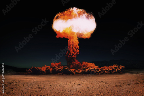 Terrible explosion of a nuclear bomb with a mushroom in the desert. Hydrogen bomb test. World War 3. Nuclear catastrophe