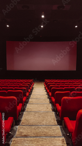 cinema auditorium with red chairs liminal space
