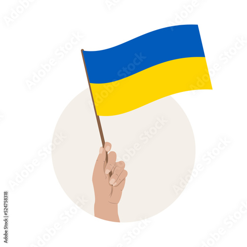 Uniesiona ręka z flagą Ukrainy. Święto 24 Sierpnia - Dzień Niepodległości Ukrainy. Stop wojnie i przemocy. Wsparcie dla Ukrainy.