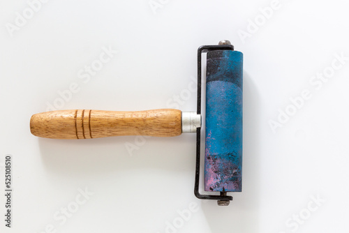 Rubber brayers with wooden hand held use in craft process on white background in top view.