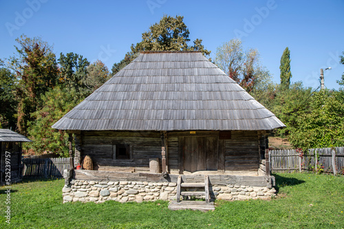 Old wooden house – traditional romanian style – at village museum Curtisoara, Gorj, Romania