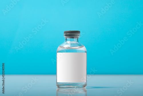 Blank bottle vial of Covid-19 coronavirus vaccine on background of covid-19 quarantine