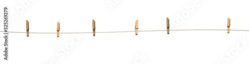 Old wooden clothespins on a rope isolated on transparent background