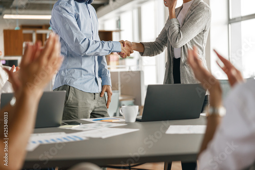 Close up of boss leader shaking hand of new team member recruiting him for job on staff briefin