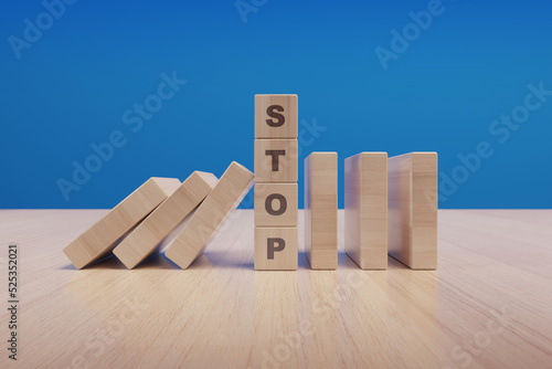 Stop text made with wooden blocks on a table