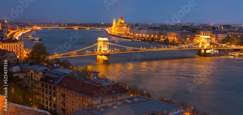 Night view of Hungarian Parliament building and Budapest Chain Bridge, Danube river