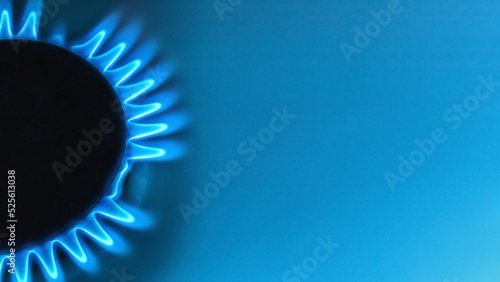 blue natural gas flame with space for text on light blue background