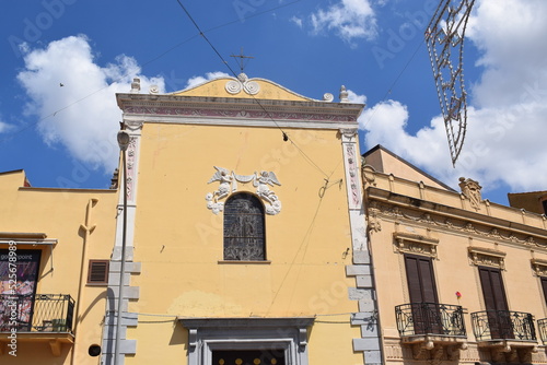 A small church with yellow walls in Partinico