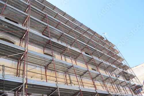 High-rise building in partinico, with construction scaffolding