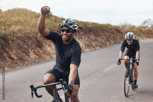 Winner, celebrating and winning cyclist cycling with his friend and racing outdoors in nature. Victory, joy and happy bicycle rider exercising on a bike for his workout routine on the road