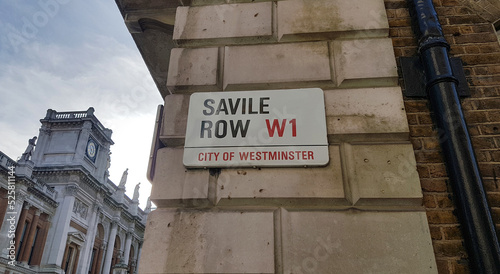 LONDON, UNITED KINGDOM, FEBRUARY 26, 2022 - Savile Row street sign in London, City of Westminster where the Beatles played the last concert, the rooftop concert, on January 30th, 1969